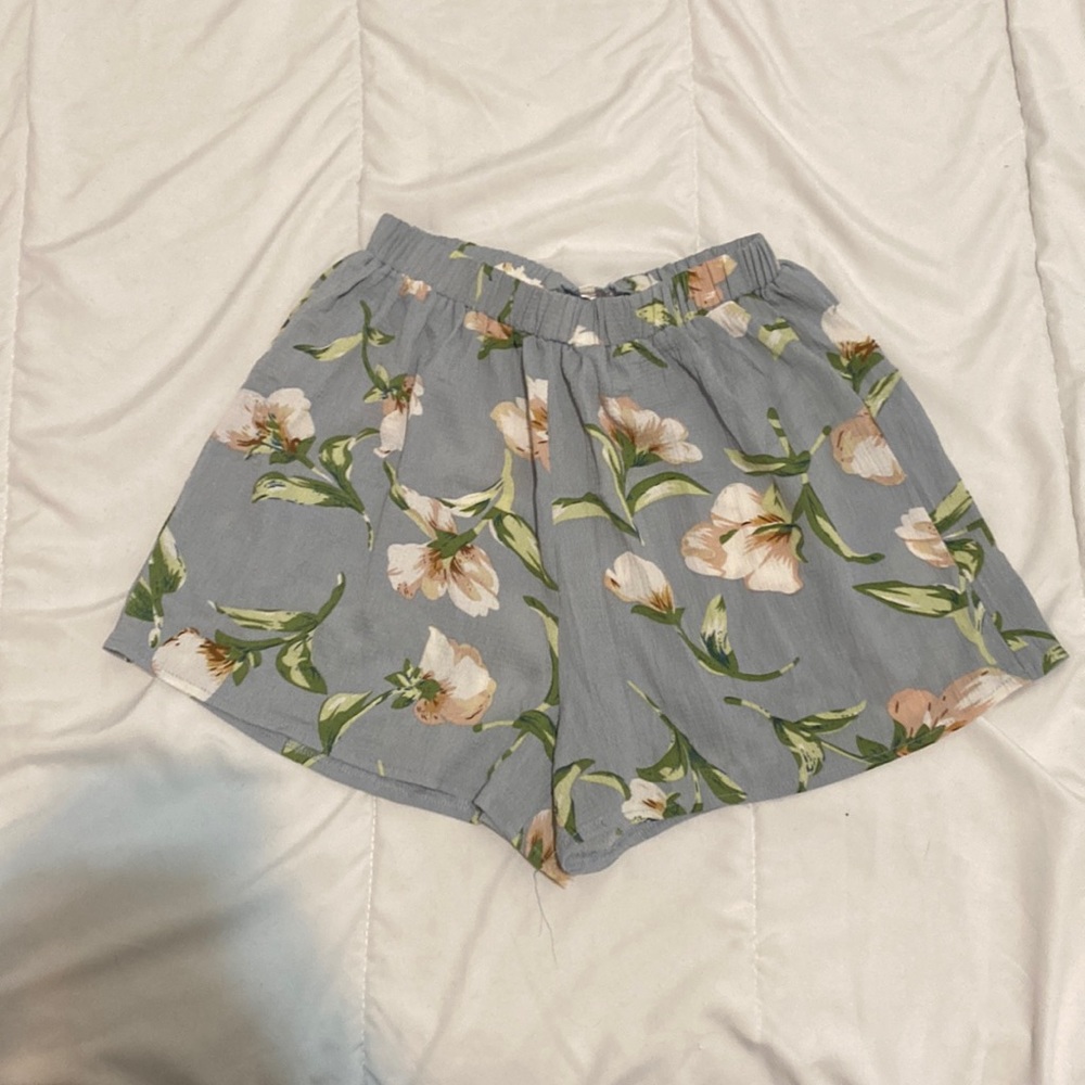 Blue shorts with flower pattern